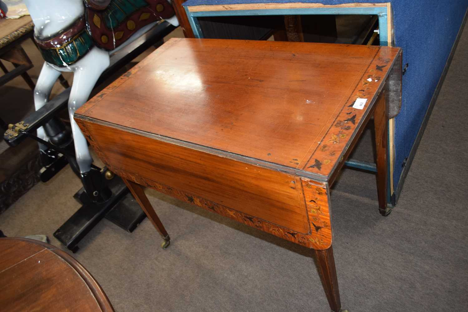 Georgian inlaid satin wood Pembroke table, the top inlaid with a floral border raised on tapering