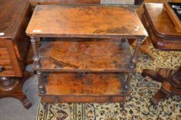 A Victorian walnut veneered three tier shelf or what not with base drawer, 68cm wide Overall very