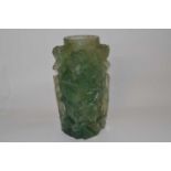 A Chinese carved quartz vase decorated in relief with carved flowers, 17cm high
