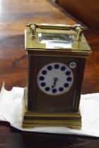 Late 19th or early 20th Century brass cased carriage clock with white and blue enamel dial with