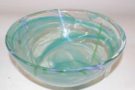 A Kosta Boda glass bowl with a green streak design, 22cm diameter