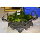 A WMF pewter centre piece in the Art Nouveau style with outswept foliate handles and a spreading