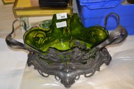 A WMF pewter centre piece in the Art Nouveau style with outswept foliate handles and a spreading