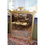 A Victorian and later gilt over mantel mirror with eagle mount, 140 x 110cm maximum