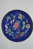 A small enamelled bowl, the blue ground with famille rose decoration, 17cm diameter (Inventory 351)