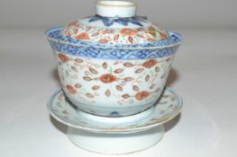 A 19th Century Chinese porcelain rice bowl, cover and stand with polychrome rice grain design (