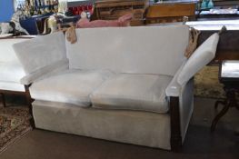 A good quality Knowle style sofa finished in mushroom upholstery with carved front pillars, 160cm