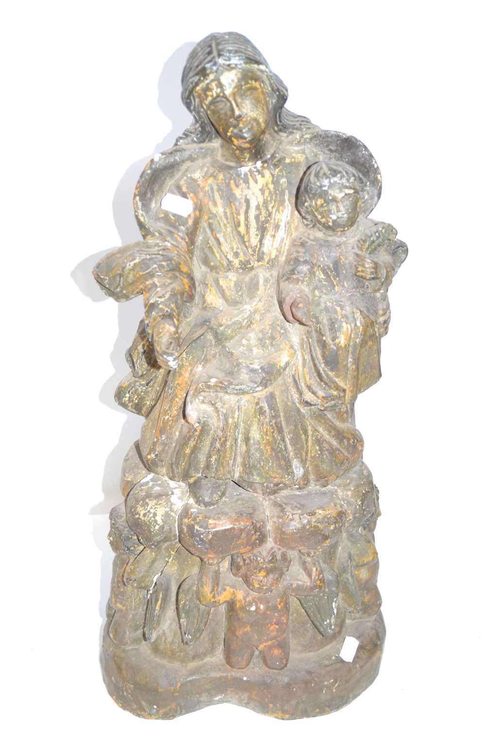 An antique hardwood carving of Mother and child with attendant angels to the base, 56cm high, losses