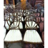 A set of ten 20th Century mahogany framed dining chairs comprising two carvers and eight standard