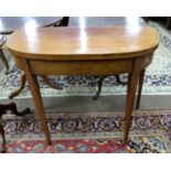 A Georgian faded mahogany D shaped tea table with inlaid banding, 91cm wide