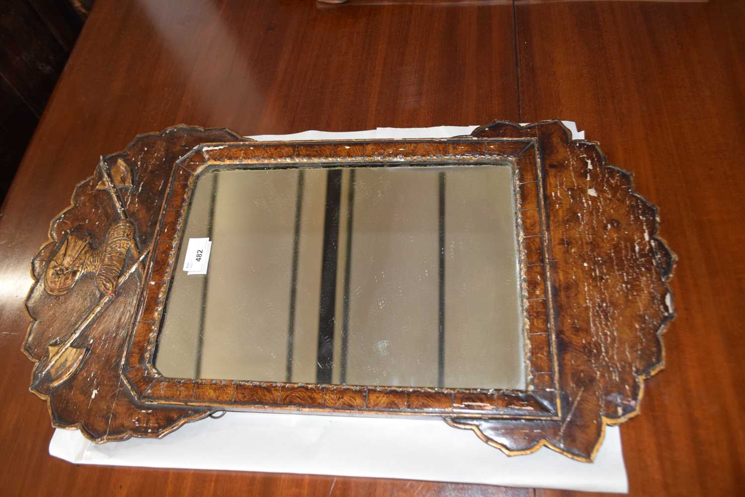 Small gesso and wood grain effect framed wall mirror with gilt highlights, marked to the reverse