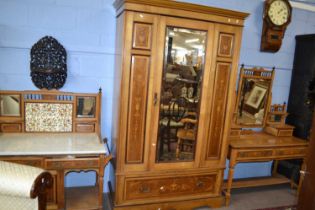 A Victorian ash and inlaid bedroom suite comprising a mirrored door wardrobe, a dressing table