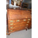 A Georgian mahogany bureau of typical form with full front, fitted interior and a base with three