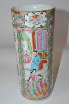 A late 19th Century Cantonese porcelain cylindrical vase, decorated in typical fashion with panels