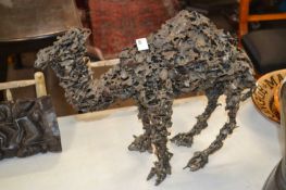 20th Century abstract pierced bronzed metal model of a dromedary, 38cm high