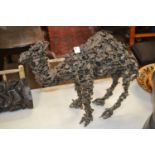 20th Century abstract pierced bronzed metal model of a dromedary, 38cm high