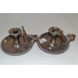 Two candle holders with snuffers in silver plate