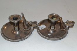 Two candle holders with snuffers in silver plate