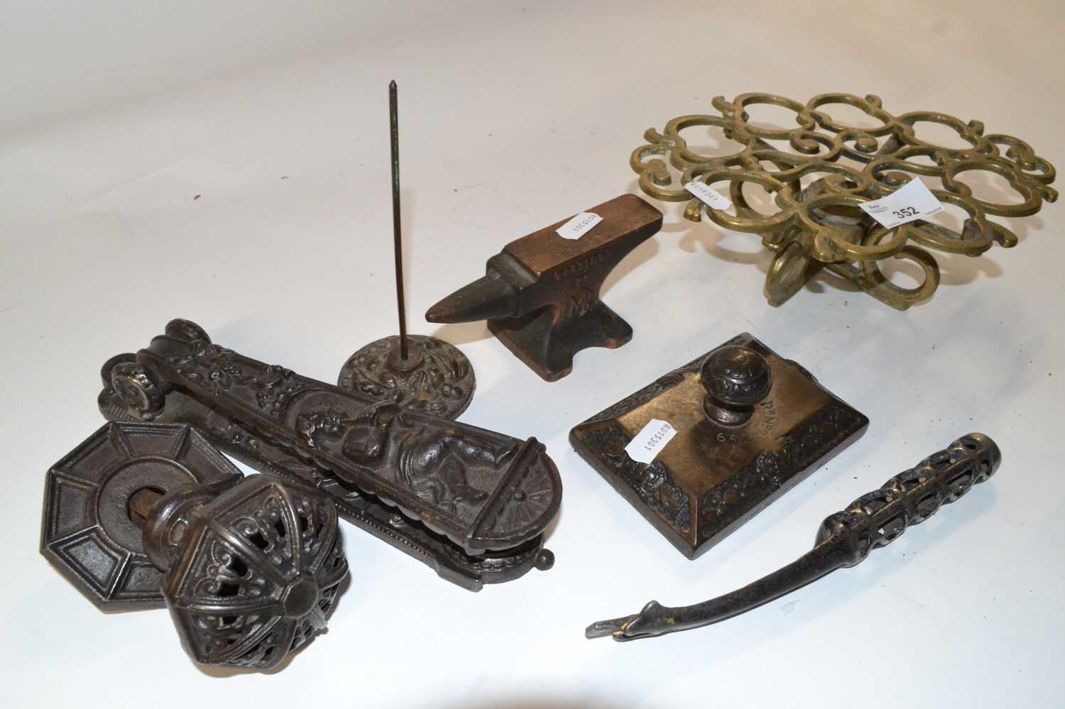 Mixed group of metal wares comprising a pierced brass trivet, a Victorian iron door knocker, a - Image 2 of 2