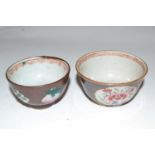 A pair of Chinese Batavia tea bowls, probably 18th Century, the cafe au lait ground with famille