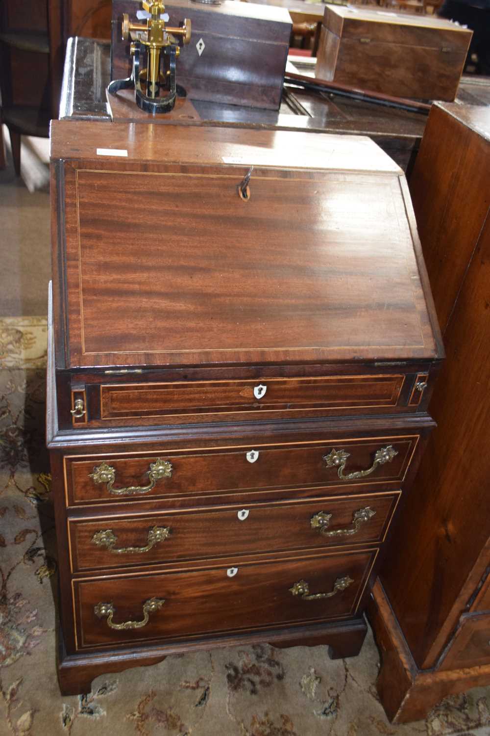 Small Georgian style mahogany bureau of narrow form with full front opening to an interior with
