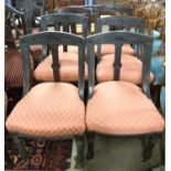 A set of six late Victorian dining chairs with pink upholstered seats and carved decoration