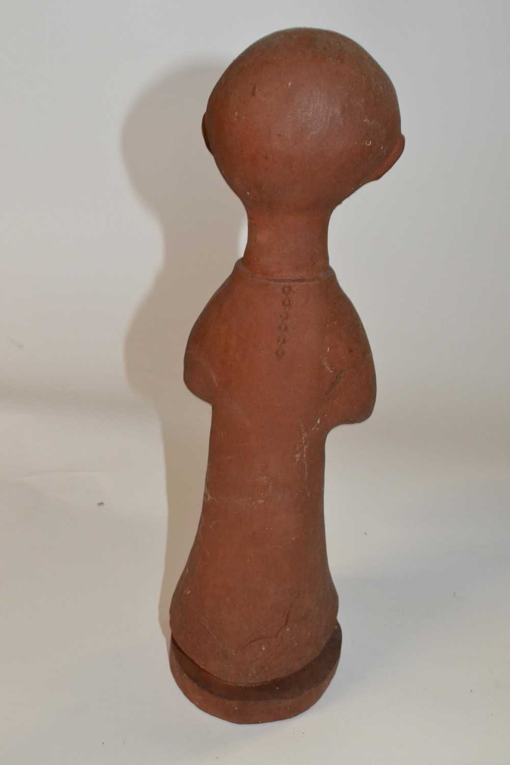 A stone ware terracotta figure of a young child with bird, on circular base, 38cm high - Image 2 of 2