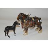 A Beswick model of a horse with saddle together with a Beswick Black Beauty foal in matt finish