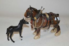 A Beswick model of a horse with saddle together with a Beswick Black Beauty foal in matt finish