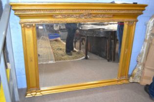 A modern over mantel mirror in a gilt effect composition frame, 170cm long