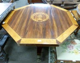 An unusual 19th Century octagonal centre table with inlaid armorial to centre, surrounded by