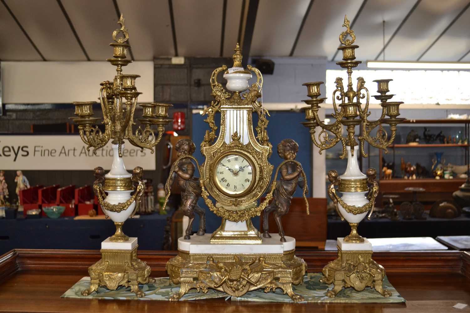 20th Century brass and grey marble clock garniture of classical form, the central clock with