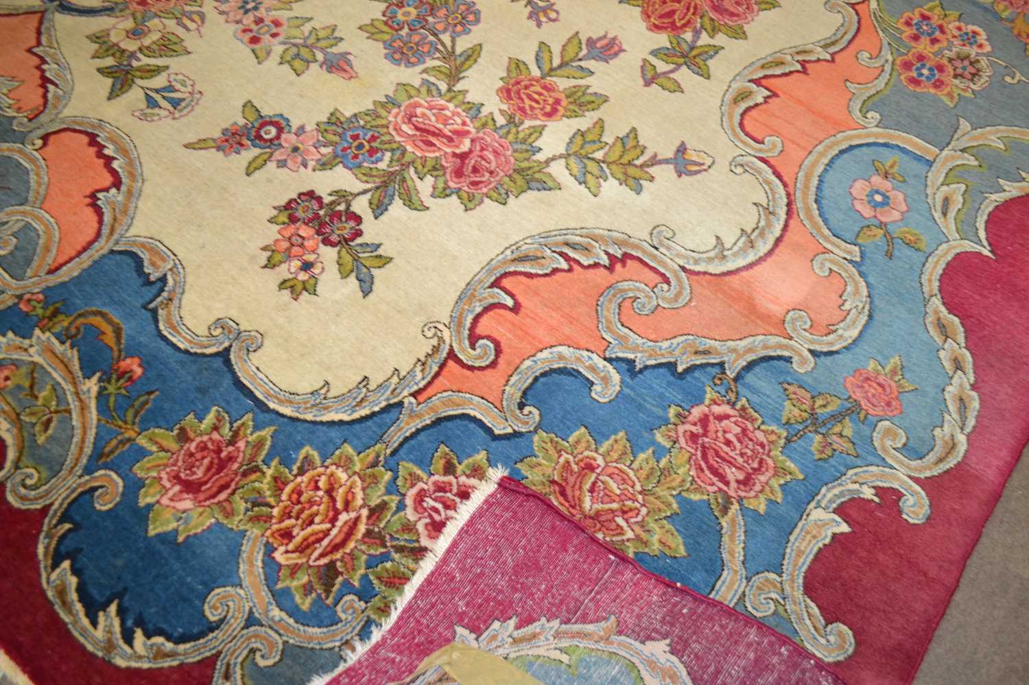 An early 20th Century wool carpet with all over rose decoration and large central cartouche - Image 3 of 3