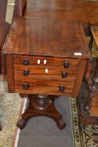 An early Victorian mahogany drop leaf small centre or sewing table raised on a turned column with