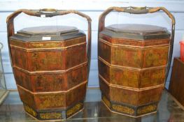 A pair of Chinese octagonal stacking food containers with lacquered decoration depicting various