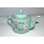 A Chinese porcelain teapot, late 19th Century, the turquoise ground with polychrome design of