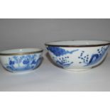 An Oriental porcelain bowl, possibly Japanese, with blue and white design and metal rim together