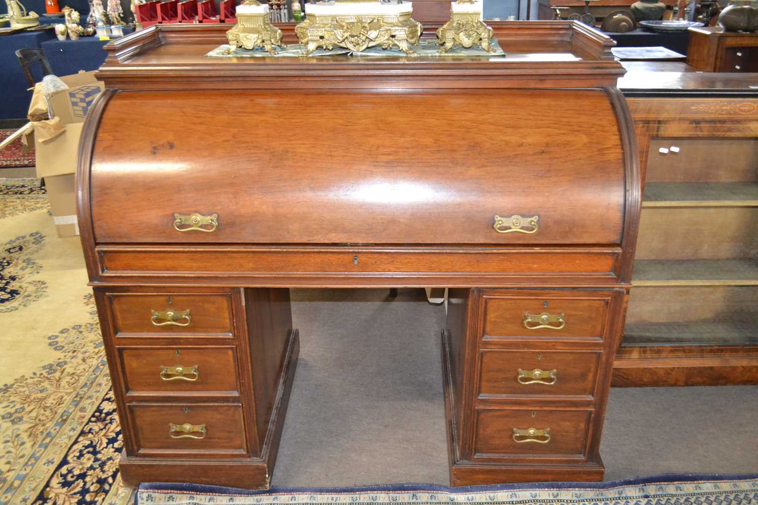 A Victorian roll top mahogany twin pedestal cylinder desk, the interior with small drawers and