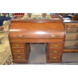A Victorian roll top mahogany twin pedestal cylinder desk, the interior with small drawers and