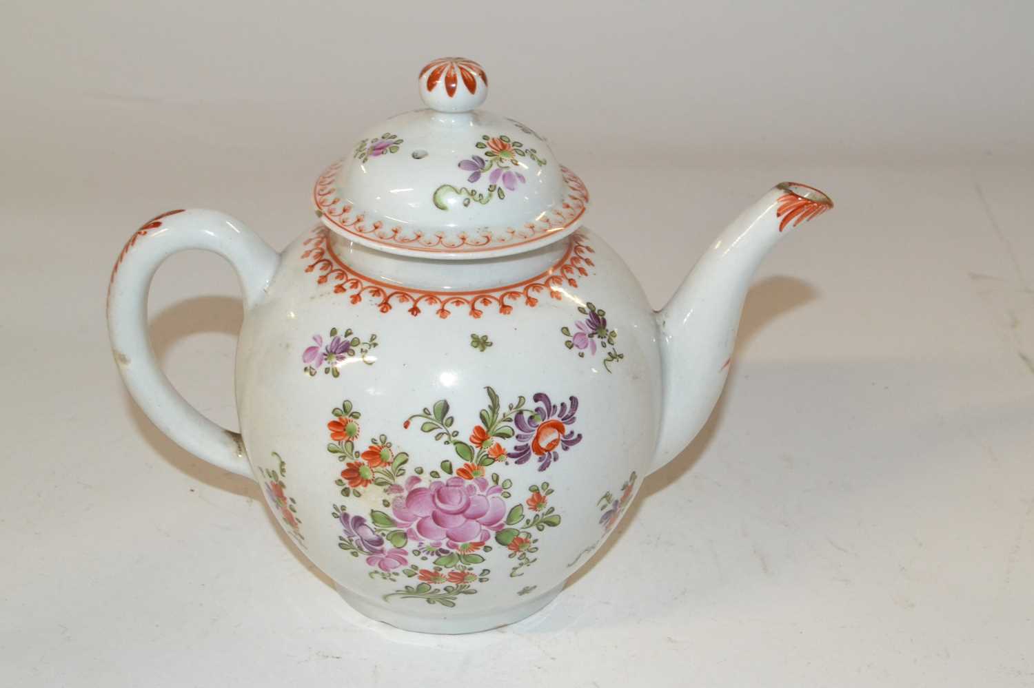 A Lowestoft teapot and cover decorated in Curtis style with design of flowers (a/f)