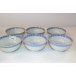 A group of six Chinese bowls, all with a rice grain design, the bowls 12cm diameter