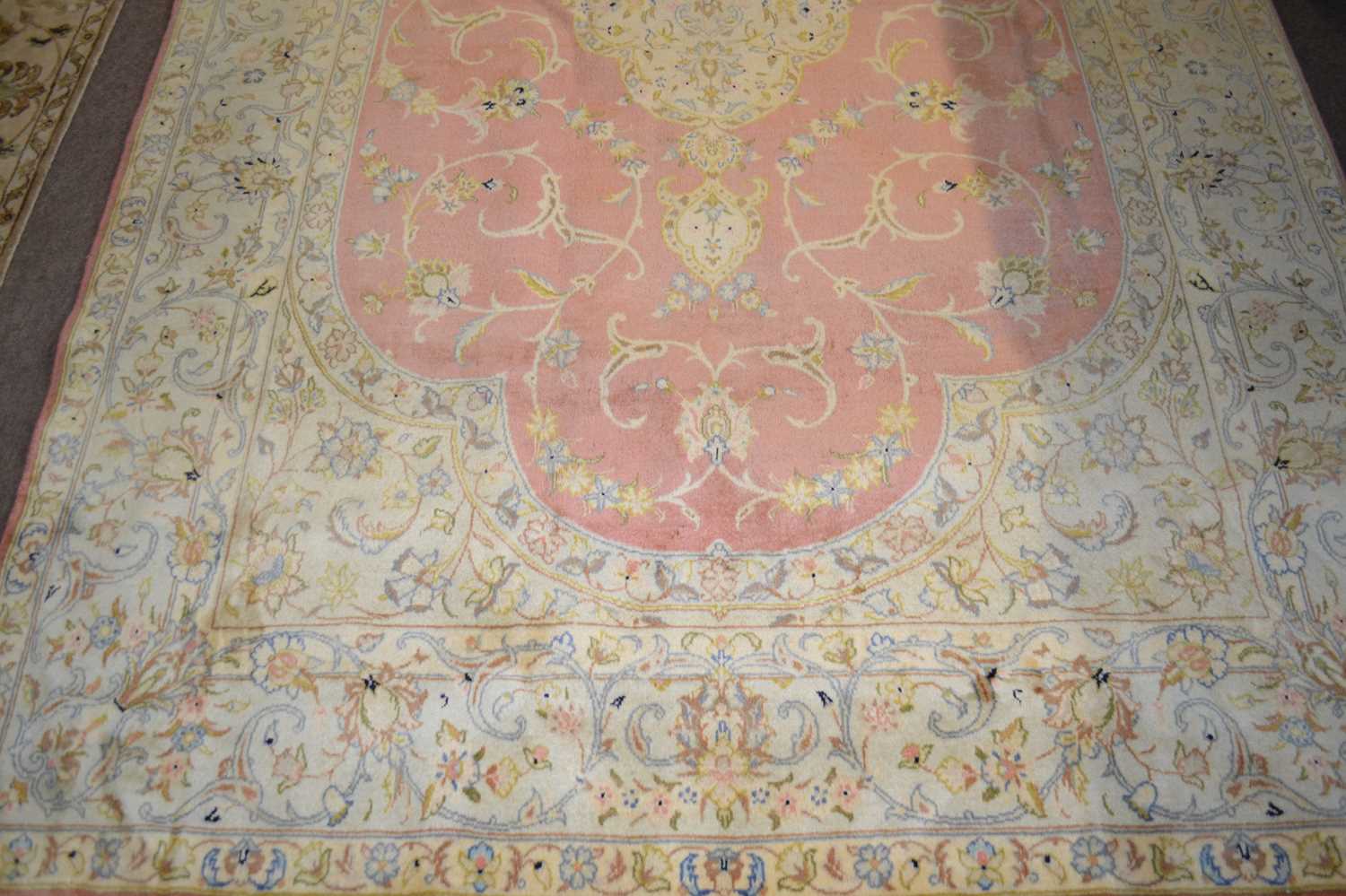 A fine Tabriz carpet with a pale border surrounding a pink central panel, decorated throughout - Image 2 of 2