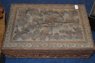 A wooden cigar box with applied floral design, 30cm long