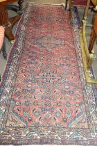 Mid 20th Century Iranian wool runner carpet with three large medallions to centre in pink, red, blue
