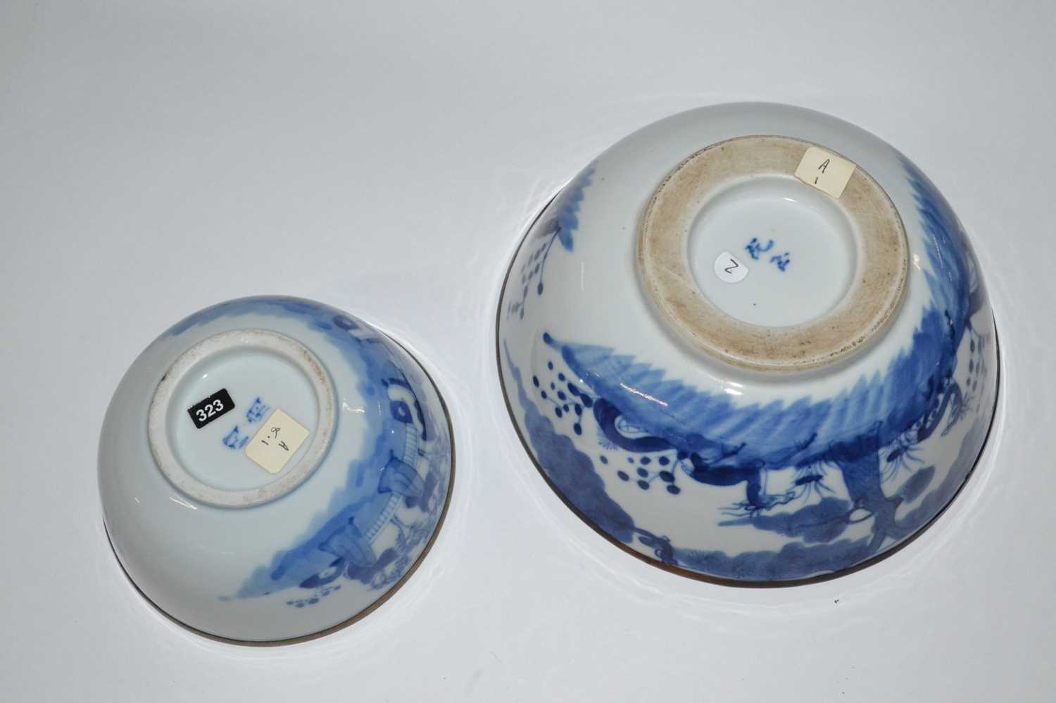 An Oriental porcelain bowl, possibly Japanese, with blue and white design and metal rim together - Image 3 of 3