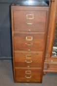 An early 20th Century oak four drawer filing chest with brass handles, 130cm high