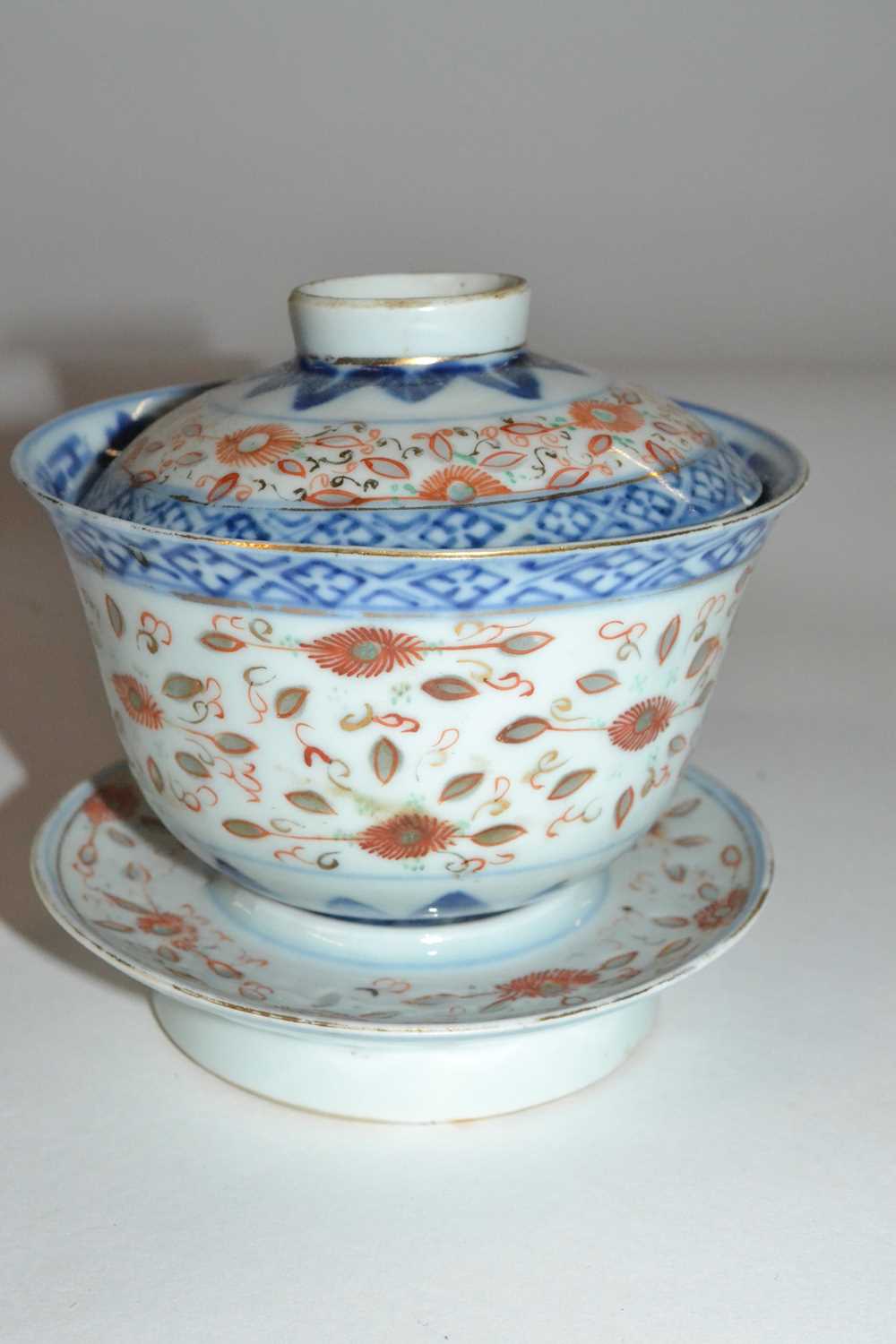 A Chinese rice bowl cover and stand, 19th Century, with polychrome design, four character mark to