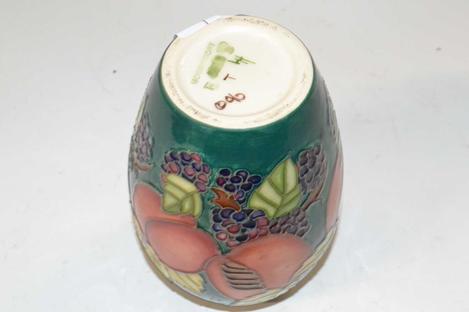 A Moorcroft vase of baluster form with tubelined fruit and flower decoration on green ground, 14cm - Image 2 of 2