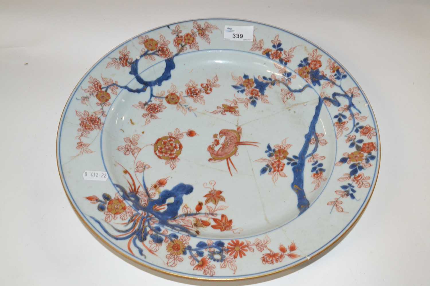 An 18th Century Chinese porcelain charger, Qianlong period, decorated in Imari style (broken and