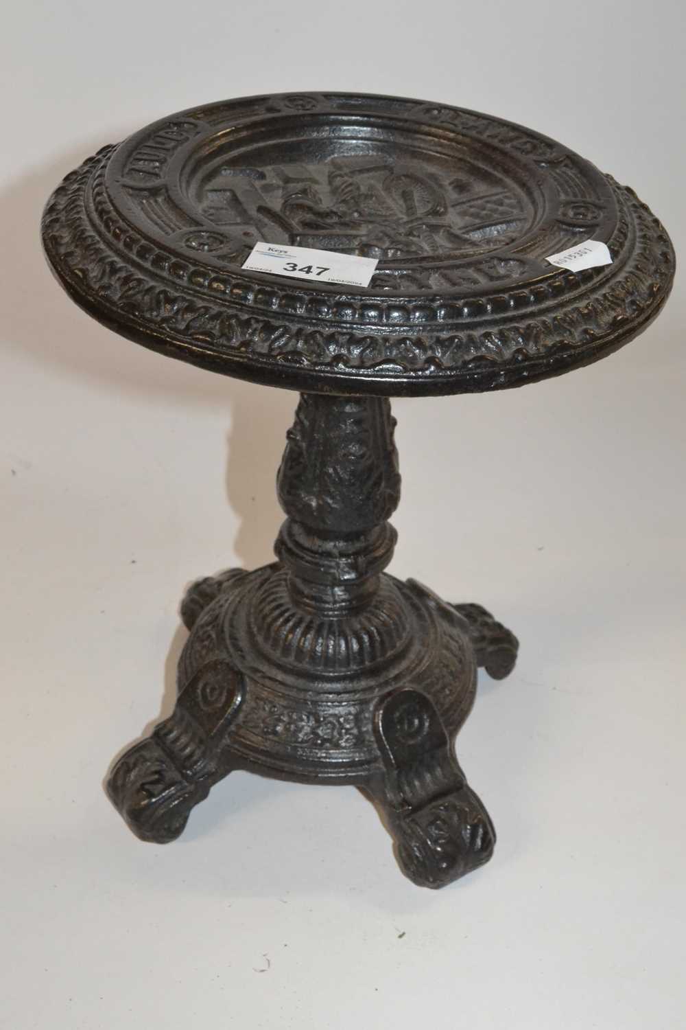 Novelty cast iron stand or trivet marked Auld Lang Syne, 27cm high